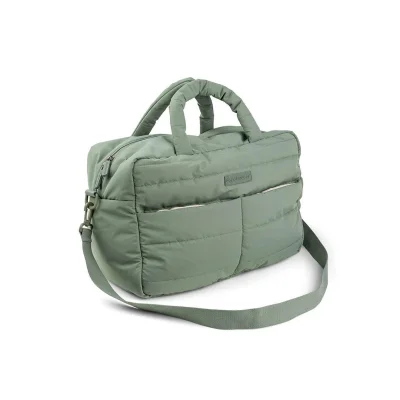 Done by Deer quilted changing bag in green showing quilted texture and shoulder straps